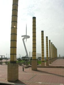 The walkway leading up to the olympic field with a very cool sculpture in the background
