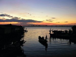 sunset and boatsman