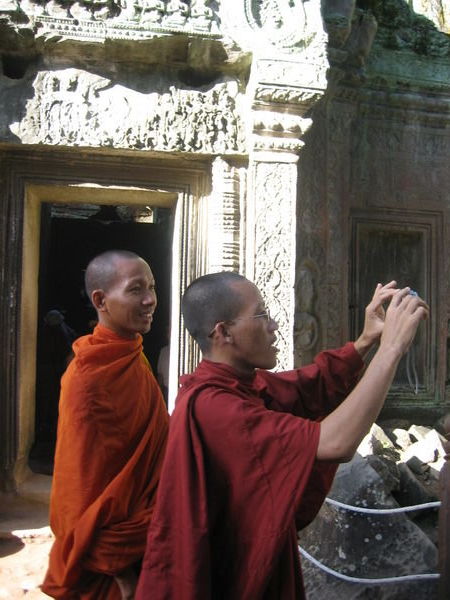 Monks in Angkor Wat taking pix