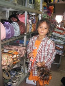 Little girl helping in market