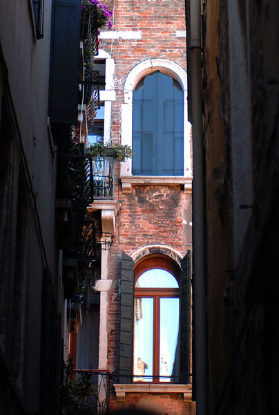 Windows framed by Narrow Calle