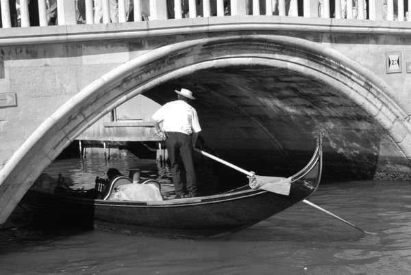 Gondola cruising under Ponte della Paglia