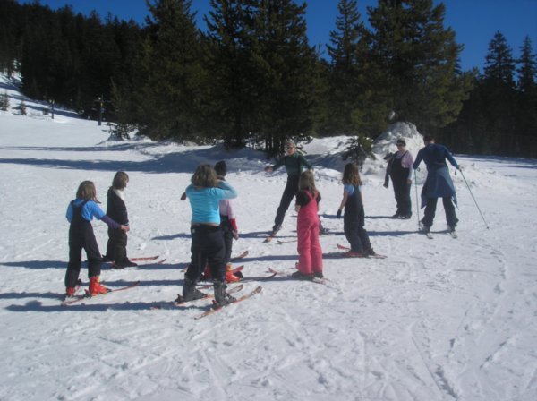 Kids getting skiing lesson