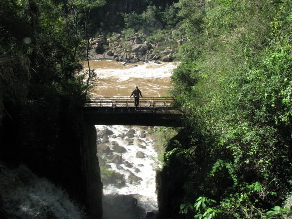 Dale on a bridge over the Iguazu River