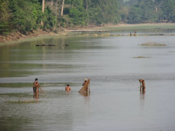 Fishermen in river