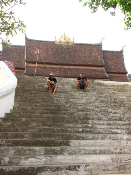 Dale and Max on the steps of Wat Xieng Thong