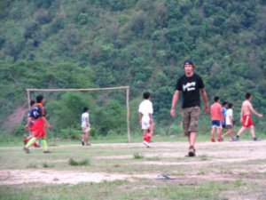 Dale playing football with the locals