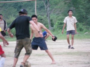 Dale playing football with the locals