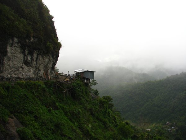 Road with hanging house