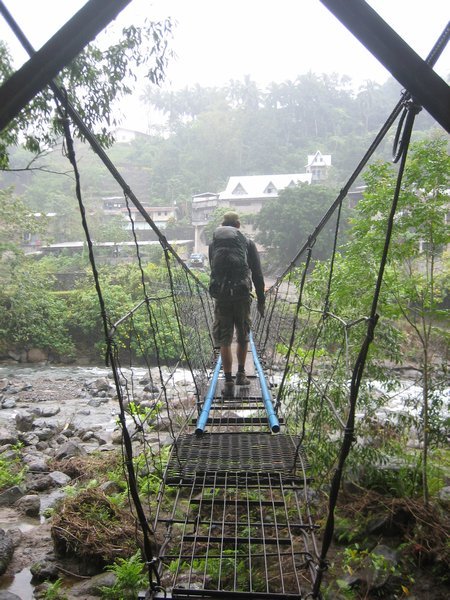 Dale on the bridge to our room in Tinglayan