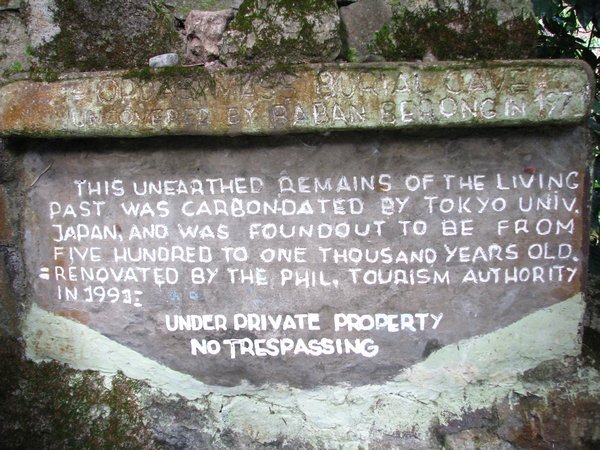 Signage outside the cave
