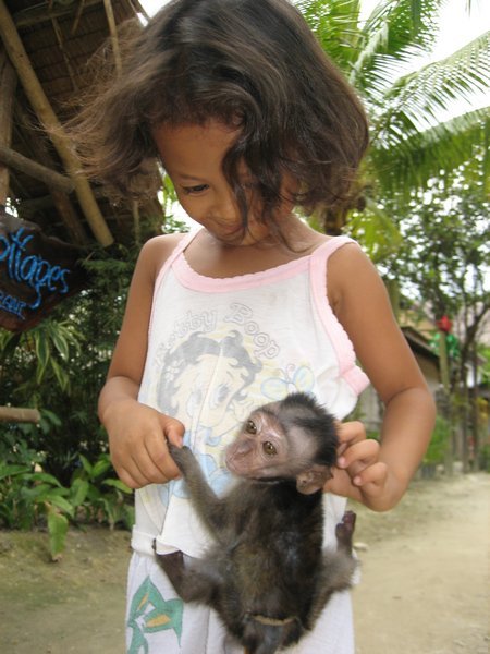 Girl and her baby monkey badge