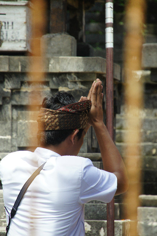 Locals praying at Ulu Watu