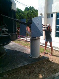 Sophie and a big gun in the museum