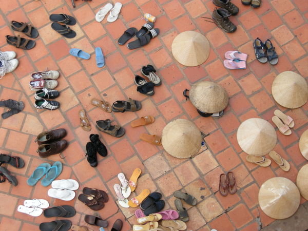 All shoes and hats to be removed before entering the temple