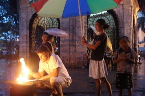 Matt lighting candles outside Magellan's Cross