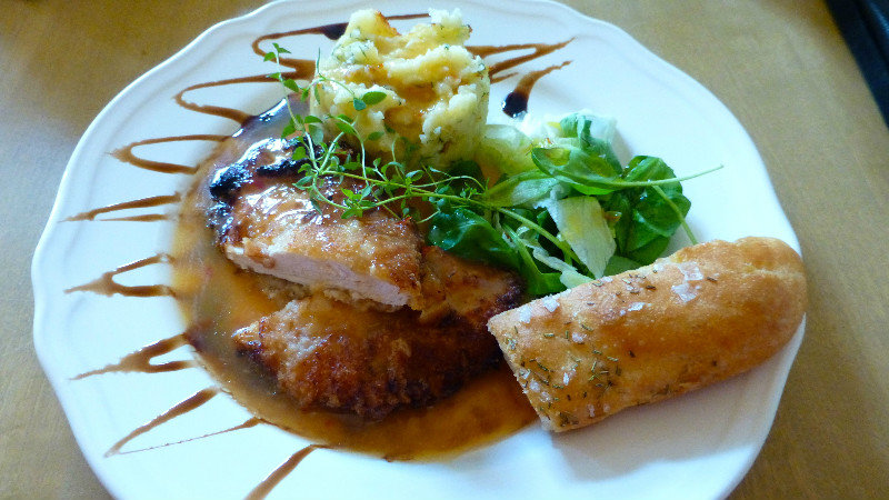 Parmesan-crusted chicken with orange and chili flavor at Muuriaare Café, Haapsalu