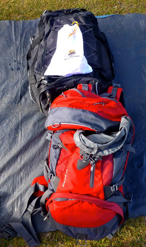 Day pack, bag with clothes and sleeping bag carried by burrows, and daily snack bag