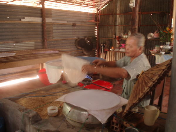 Lady making rice paper