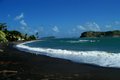 Volcanic black sand beach on the island of Grenada
