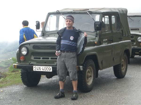 Martyn in front of one of the transportation Jeeps