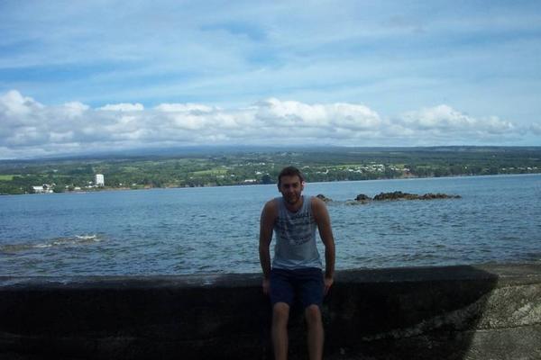 Silly me with Mauna Kea volcano in background (behind clouds)