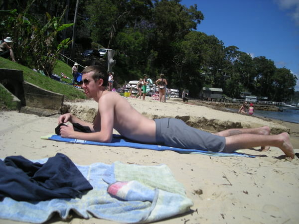Chris tanning on the beach