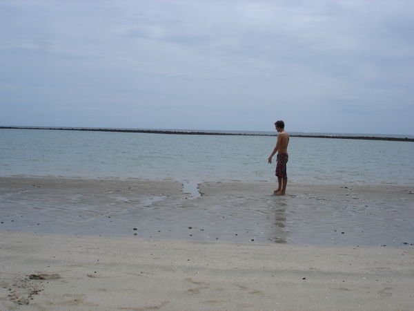 Chris standing on the beach at the lagoon