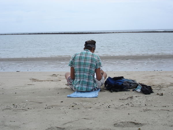 Evan reading on the beach