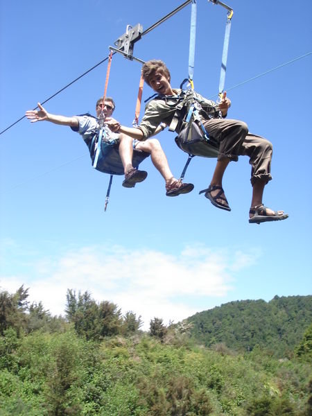 Geoff and Evan flying by on the tandem swing