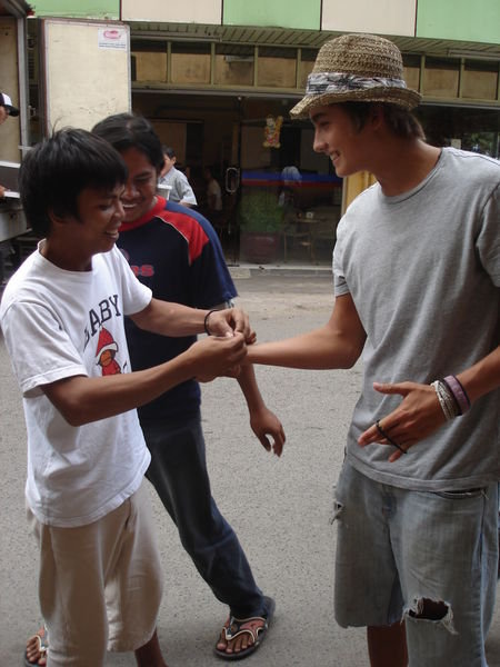 Evan trading bracelets with locals
