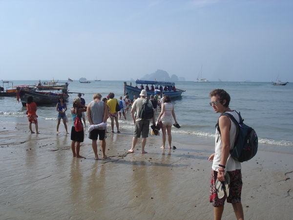 Everyone heading to our longtail boat off the beach