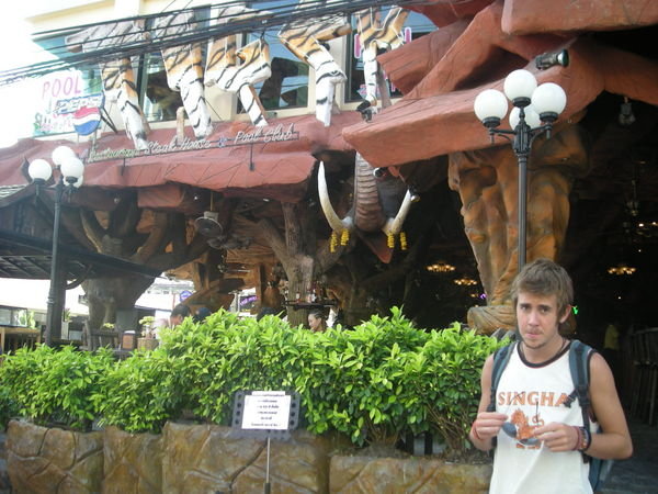 chris in front of a rediculous jungle restaurant in Patong