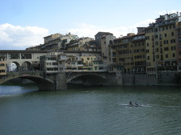 rowers under the Ponte Vecchio