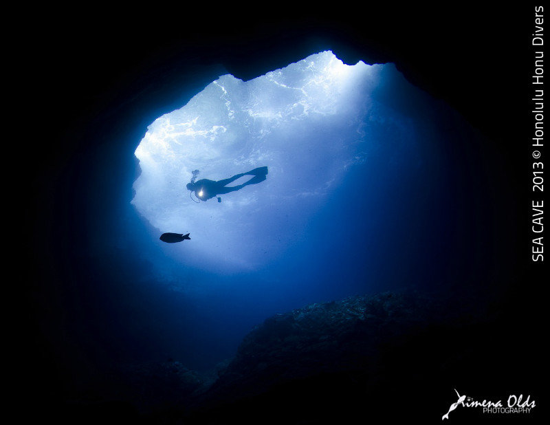 Sea Cave. Diver and white surge