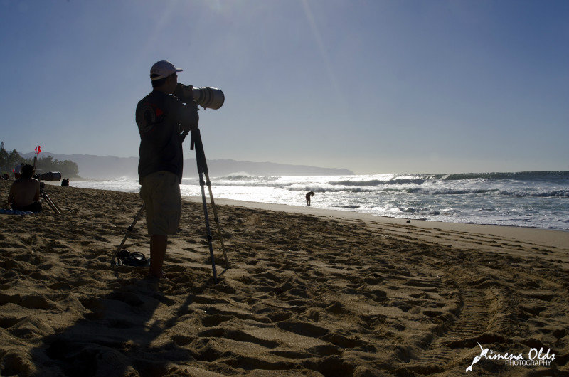 Photographing the whale behind the surfers!