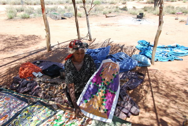 Aboriginal lady selling her art in the outback