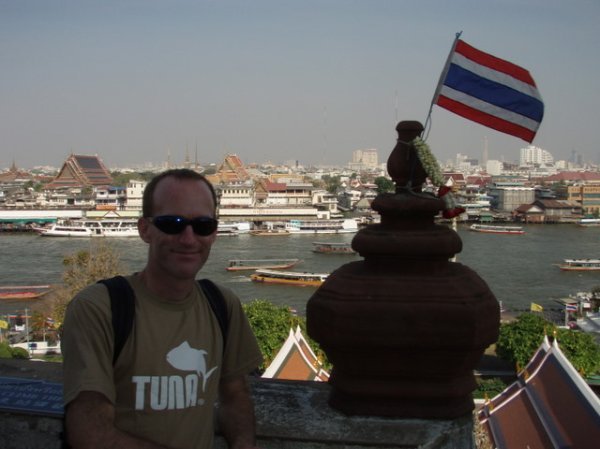 A tourist, a Thai flag and a view