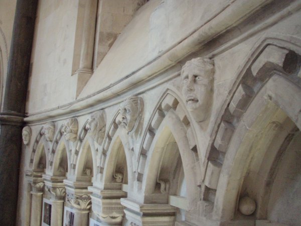 Strange faces line the walls of the Temple Church