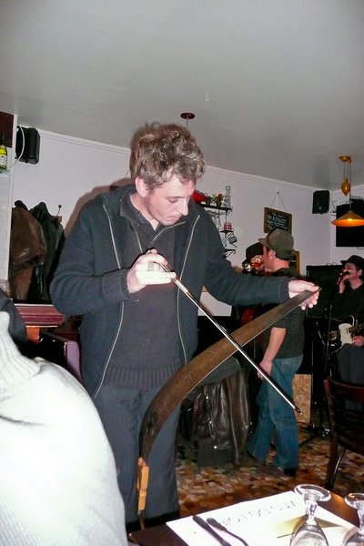Musician playing a saw