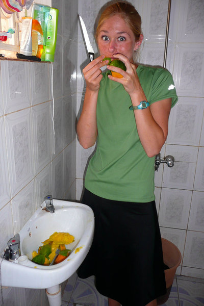 Kristina scoffing mangoes in the bathroom!