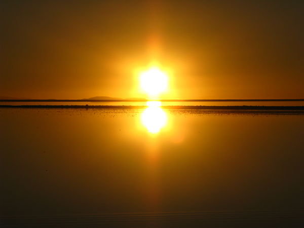Sunrise reflection on the Salar de Uyuni