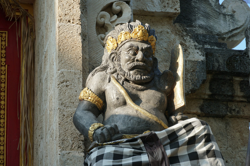 pemuteran - hindu statue with sacred cloth
