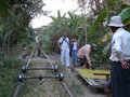 bamboo train being dismantled