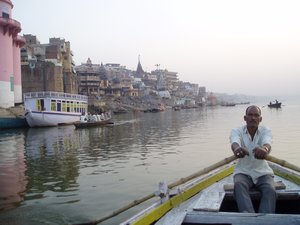 From a boat at sunrise by one of the ghats.
