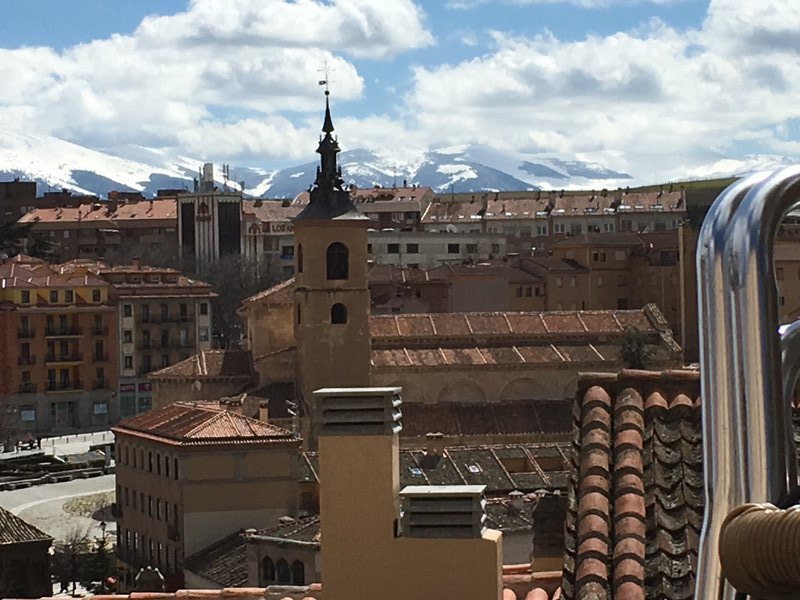 Segovia with snow-covered mountaos