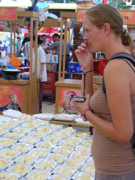 Catherine preparing herself at the Durian stand
