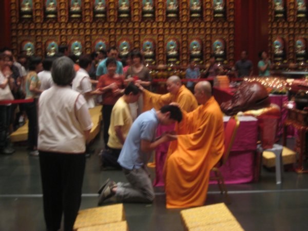 Blessings at the Buddah Tooth Relic Temple