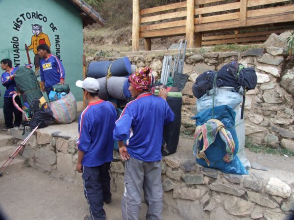 Porters waiting to get their bags weighed at the checkpoint