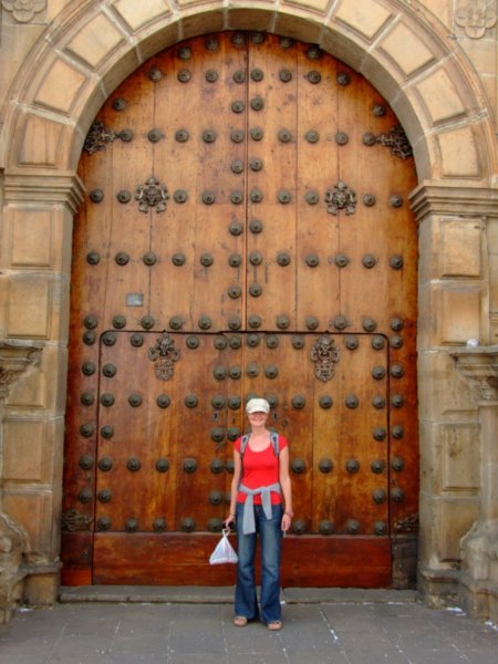Catherine by a big door